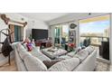 Comfortable living room with a large sectional sofa, city views, and access to the balcony at 222 Karen Ave # 3305, Las Vegas, NV 89109