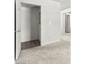 Bedroom view featuring closet, neutral carpet and mirrored doors at 2606 S Durango Dr # 276, Las Vegas, NV 89117