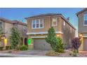 Two story home with desert landscaping and a two car garage on a brick driveway at 2787 Donatello Manor Pl, Henderson, NV 89044
