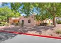 An exterior view of a single-story home, landscaped with desert plants at 2851 S Valley View Blvd # 1120, Las Vegas, NV 89102