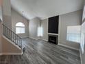 Bright living room featuring modern flooring, a fireplace, and large windows at 3238 Canyon Terrace Dr, Laughlin, NV 89029