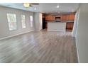 Spacious living room featuring hardwood floors and large windows providing ample natural light at 3617 Austell St, Las Vegas, NV 89129