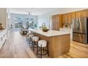 Spacious open-concept kitchen with a large island, seating, and views of the living room at 4314 Livorno Ave, Las Vegas, NV 89141