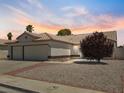 Well-maintained single story home with desert landscaping and tile roof at 4323 Pageantry Falls Dr, North Las Vegas, NV 89031
