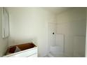 Clean, new bathroom with tiled shower, ready for personalized finishing touches at 4684 Parkarbor Ave, Las Vegas, NV 89141