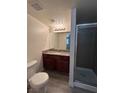 Functional bathroom showcasing a vanity with a granite countertop and a glass-enclosed shower at 5251 Indian River Dr # 271, Las Vegas, NV 89103