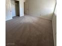 Neutral bedroom featuring plush carpeting, ample natural light, and a spacious closet at 5251 Indian River Dr # 271, Las Vegas, NV 89103