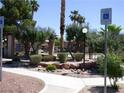 A landscaped common area offers seating and manicured shrubbery for resident enjoyment at 5751 E Hacienda Ave # 137, Las Vegas, NV 89122