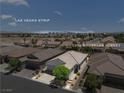 Aerial view of the property with the Las Vegas Strip in the distance at 5936 Bruselas Street at 5936 Bruselas St, Las Vegas, NV 89113