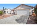 Beautiful home with two-car garage and low maintenance yard at 905 Harp Way, North Las Vegas, NV 89032