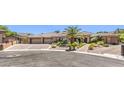 Attractive stone and stucco home features a spacious three-car garage and mature landscaping at 9135 Hickam Ave, Las Vegas, NV 89129