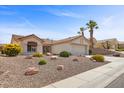 Charming home with desert landscaping, a tile roof, and a convenient two-car garage at 10413 Marymont Pl, Las Vegas, NV 89134