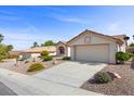 Beautiful home featuring desert landscaping, a tile roof and an attached two car garage at 10413 Marymont Pl, Las Vegas, NV 89134