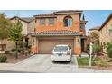 Charming two-story house with a well-manicured front yard and two-car garage at 11620 Longhirst Hall Ln, Las Vegas, NV 89138