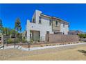 Contemporary two-story home with a modern design, low-maintenance landscaping, and mountain views in background at 11739 Emerald Lake Ave, Las Vegas, NV 89138