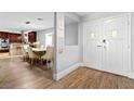 Inviting entryway with hardwood floors leading to a modern, renovated kitchen at 120 W Highland Dr, Henderson, NV 89015