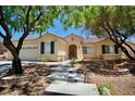 Attractive single-story home with a two-car garage and landscaped front yard at 1830 Lake Wales St, Henderson, NV 89052