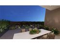 Outdoor patio area with dining table, chairs, and desert views at 25 Sand Star Ln, Henderson, NV 89011
