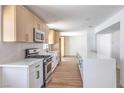 Bright kitchen featuring a white island and stainless steel appliances at 2611 Siesta Ave, Las Vegas, NV 89121