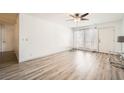 Spacious living area with wood floors, bright windows, and a door leading to the outside at 2838 Geary Pl # 4017, Las Vegas, NV 89109