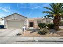 Inviting single-story home with desert landscaping and an attached garage at 3108 Sentimental Ct, North Las Vegas, NV 89031