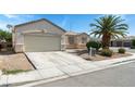 Single-story home featuring desert landscaping and a spacious two-car garage at 3108 Sentimental Ct, North Las Vegas, NV 89031