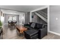 Bright living room with hardwood floors, neutral paint, and a staircase to the second floor at 3158 Brockington Dr, Las Vegas, NV 89120