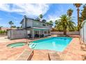 Relaxing backyard oasis with a private pool, spa, and covered patio perfect for outdoor entertaining at 3158 Brockington Dr, Las Vegas, NV 89120