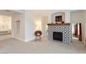 View of the living room with fireplace, chair and doorway leading to other rooms at 3934 Sangre De Cristo Ave, Las Vegas, NV 89118