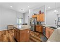 Bright kitchen with granite countertops, stainless steel appliances, center island, and ample cabinet space at 4212 Helens Pouroff Ave, North Las Vegas, NV 89085
