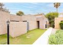 Charming home exterior with landscaped front yard, walkway, and neutral stucco facade at 4232 Park Ct, Las Vegas, NV 89110