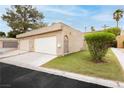 Spacious two-car garage with well-manicured lawn and desert landscaping at 4232 Park Ct, Las Vegas, NV 89110