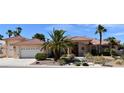 Charming single-story home featuring a tile roof, desert landscaping, and a well-manicured yard at 7250 Birkland Ct, Las Vegas, NV 89117