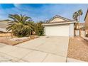 Charming single-story home featuring a two-car garage, a driveway, and low maintenance landscaping at 9514 Teton Vista Ave, Las Vegas, NV 89117