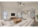 Bright living room featuring vaulted ceiling, contemporary furnishings, and hardwood floors at 10001 Peace Way # 2322, Las Vegas, NV 89147