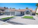 Charming single-story home featuring a tile roof, a two-car garage, and low-maintenance landscaping at 1553 Bright View Dr, Las Vegas, NV 89119