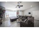Inviting living room with comfortable sectional, bright windows, and contemporary furnishings at 1553 Bright View Dr, Las Vegas, NV 89119