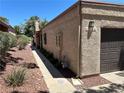 Exterior view of the home and the two-car garage at 1866 Camino Verde Ln, Las Vegas, NV 89119