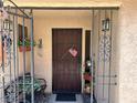 Gated front porch with seating, plants and decor at 1866 Camino Verde Ln, Las Vegas, NV 89119