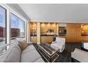 Open living room with city views features comfortable seating and a convenient kitchenette at 2000 N Fashion Show Dr # 5617, Las Vegas, NV 89109