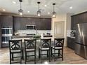 Beautiful kitchen with granite countertops, stainless steel appliances, and pendant lighting at 2645 Cava Tirreni St, Henderson, NV 89044