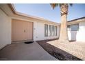 Inviting front entrance featuring double doors and desert landscaping at 2755 E Russell Rd, Las Vegas, NV 89120