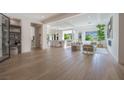 Spacious living area with wood floors, modern furnishings, and ample natural light creating an inviting atmosphere at 2797 Turtle Head Peak Dr, Las Vegas, NV 89135