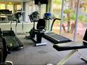 Well-equipped community gym with treadmills, stationary bikes, and large windows for a bright workout space at 3055 Key Largo Dr # 204, Las Vegas, NV 89120