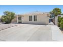 Single-story home featuring a spacious driveway and gated side yard at 321 Oil Lantern Ln, Las Vegas, NV 89145