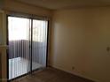 Bright living area with sliding glass doors leading to a balcony at 4050 Pacific Harbors Dr # 214, Las Vegas, NV 89121