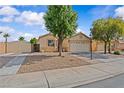Charming single-story home with well-maintained landscaping, mature trees, and a spacious driveway at 5115 Morning Splash Ave, Las Vegas, NV 89131