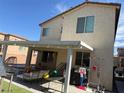 Backyard featuring covered patio perfect for outdoor dining and entertaining at 7468 Wellfleet Bay Ave, Las Vegas, NV 89179