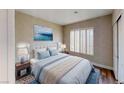 Serene bedroom with plush bedding, shuttered windows, and calming decor at 8070 W Russell Rd # 1046, Las Vegas, NV 89113