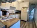 Functional kitchen with white cabinets, double sink, and convenient layout for meal preparation at , Las Vegas, NV 89119